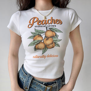 
            
                Load image into Gallery viewer, Retro Peaches Baby Tee ~ HANDMADE
            
        