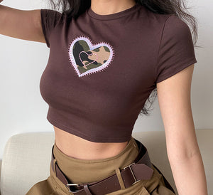
            
                Load image into Gallery viewer, Camouflage Heart Baby Tee
            
        